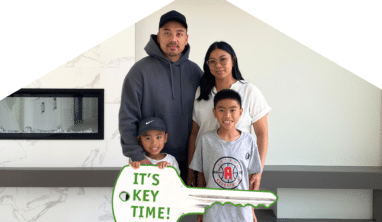 Key time - Parents with their children celebrate receiving keys to their new home